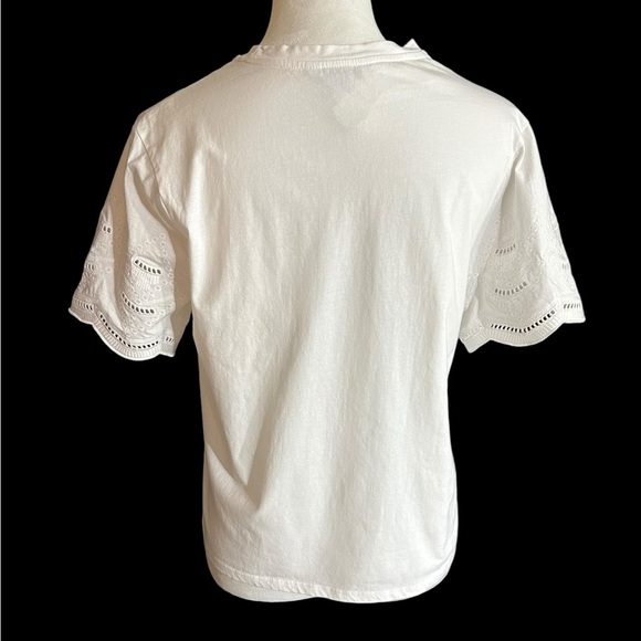 An Ophelia Roe short sleeved white pullover blouse with top and sleeve eyelets - Picture 3 of 8